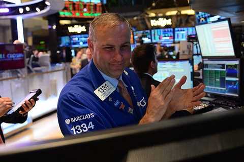 US stocks hit record highs as key Fed policy meeting gets underway