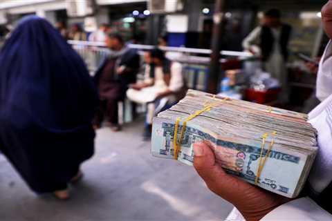 Afghan banks are running out of cash and are begging the Taliban for more money after the US froze..